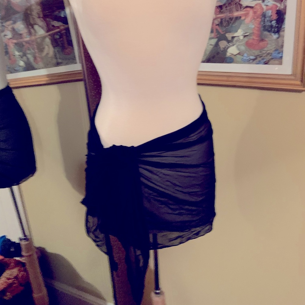 Black coverup sarong skirt. Soft stretchy mesh like material. Ties at waist.